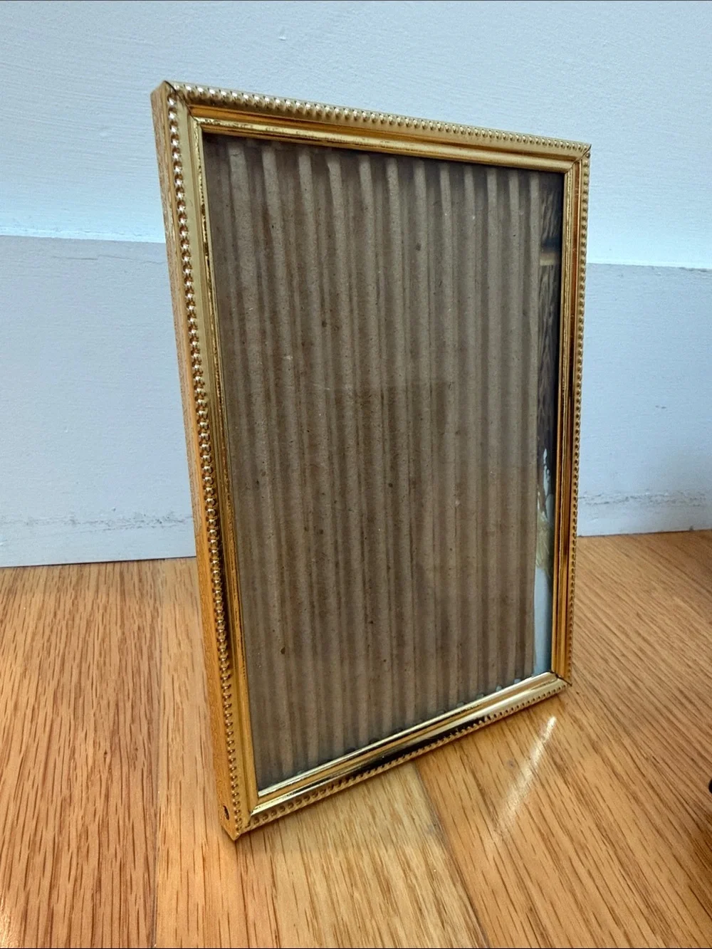 Set of three vintage gold table picture frames. 2x 5x7, 1x 4x6